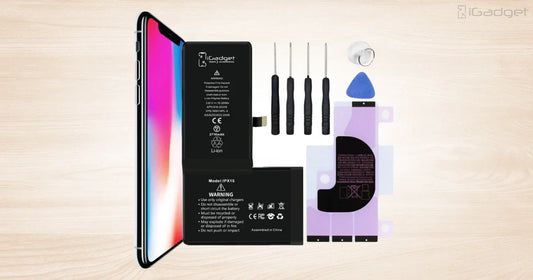 iPhone X battery replacement kit with battery, tools, adhesive, and suction cup.