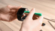 Someone performing an Apple Watch screen fix