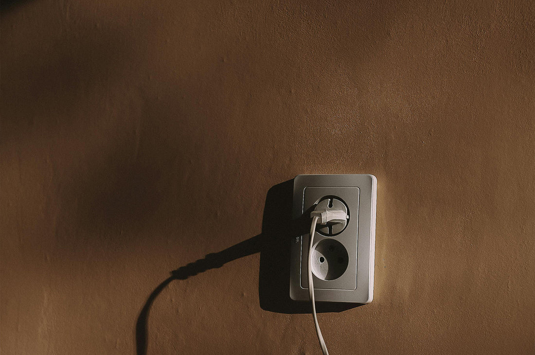 Wall charger placed on a wooden surface