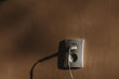Wall charger placed on a wooden surface