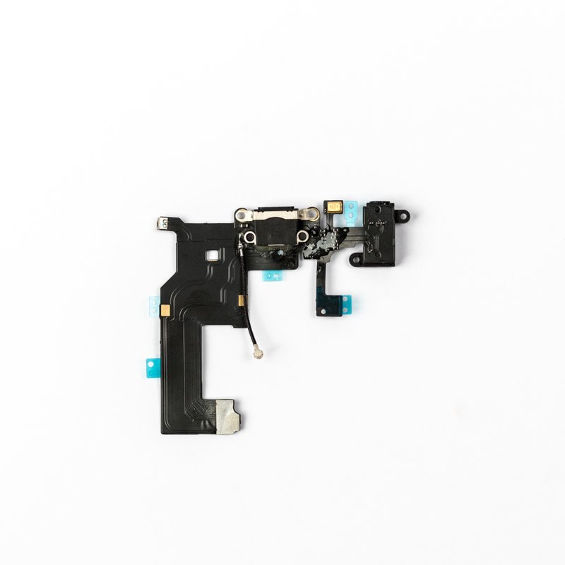 Black iPhone 5 charging port flex laid flat against white, with the Lightning connector centred, headphone jack at one end, thin coaxial antenna lead and teal protective tabs.