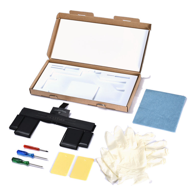 The MacBook Pro 13 inch Retina A1425 replacement battery, battery model A1437, shown in its open box with the supplied tools and accessories