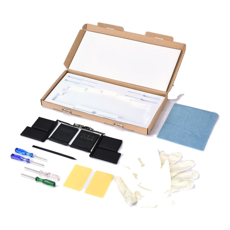 The MacBook Pro 15 inch Touch Bar A1707 replacement battery, battery model A1820, shown in its open box with the supplied tools and accessories
