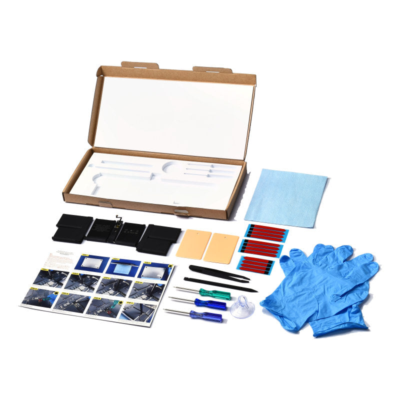 The MacBook Pro 14 inch A2442 replacement battery, battery model A2519, shown in its open box with the supplied tools and accessories
