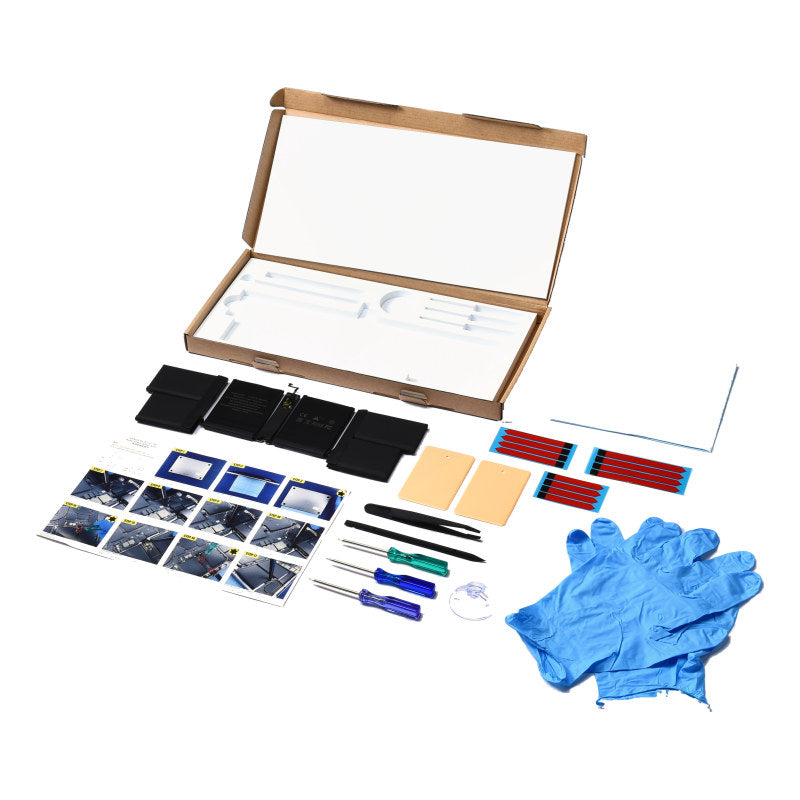 The MacBook Pro 16 inch A2485 replacement battery, battery model A2527, shown in its open box with the supplied tools and accessories