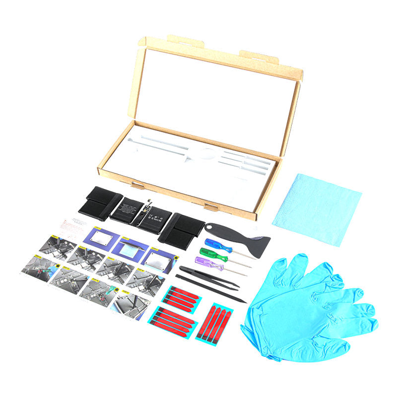 The MacBook Pro 14 inch A2992 replacement battery, battery model A2977, shown in its open box with the supplied tools and accessories