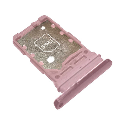 Rose pink metallic Samsung Galaxy S21 series SIM card tray shown at an angle, with a SIM1 slot recess and ejector pin hole.