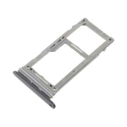 Angled view of a silver dual SIM card tray for the Samsung Galaxy S10, showing its two card openings and the dark rubber sealing gasket along the outer lip.